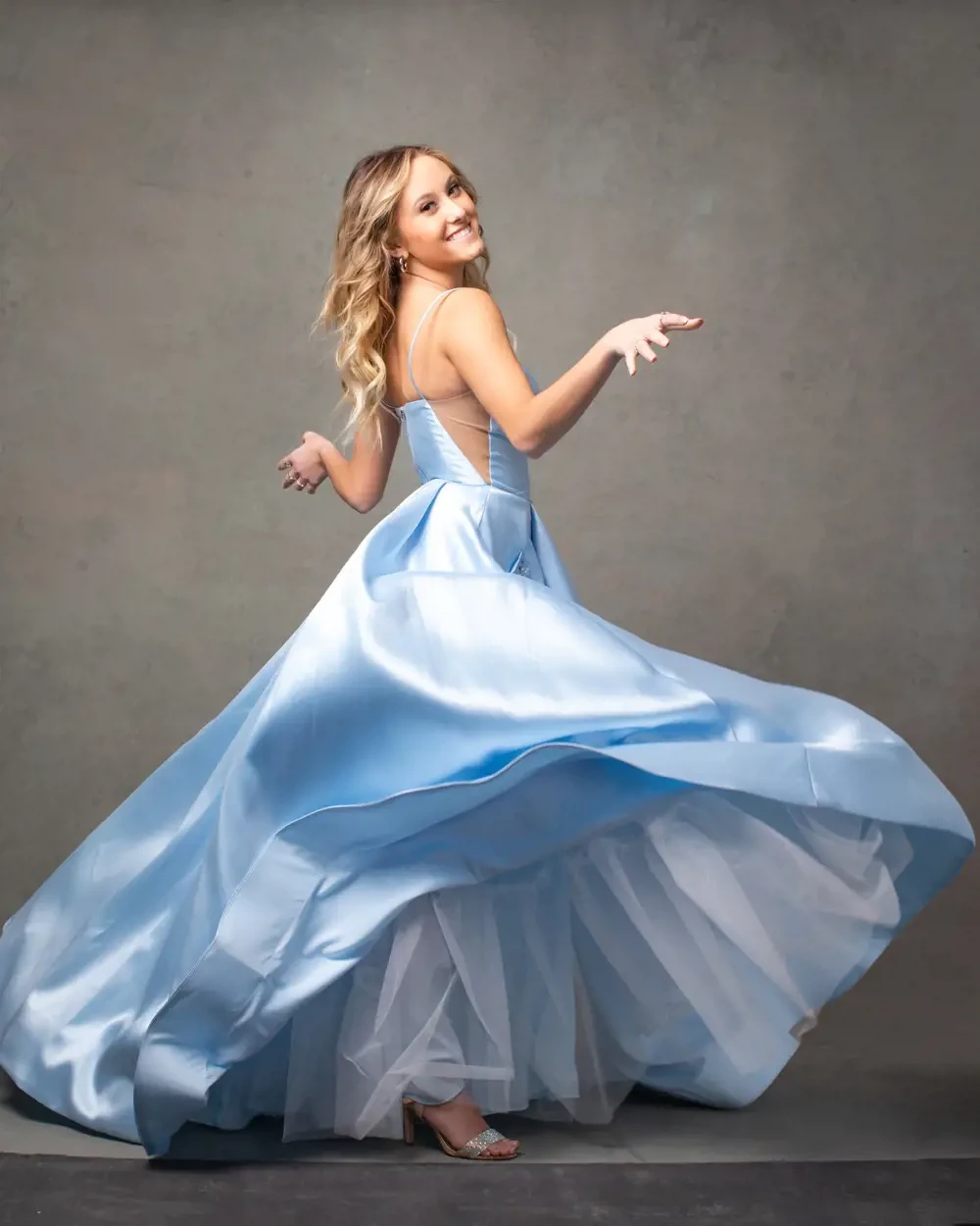 Model wearing a blue dress