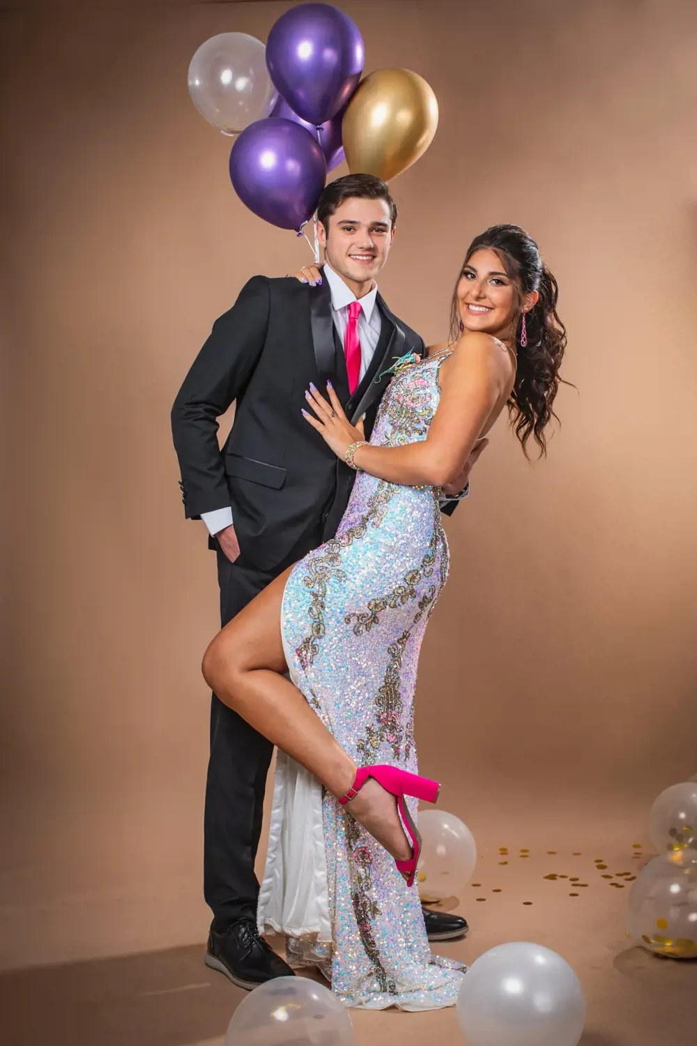 Сouple wearing a white gown and a black suit