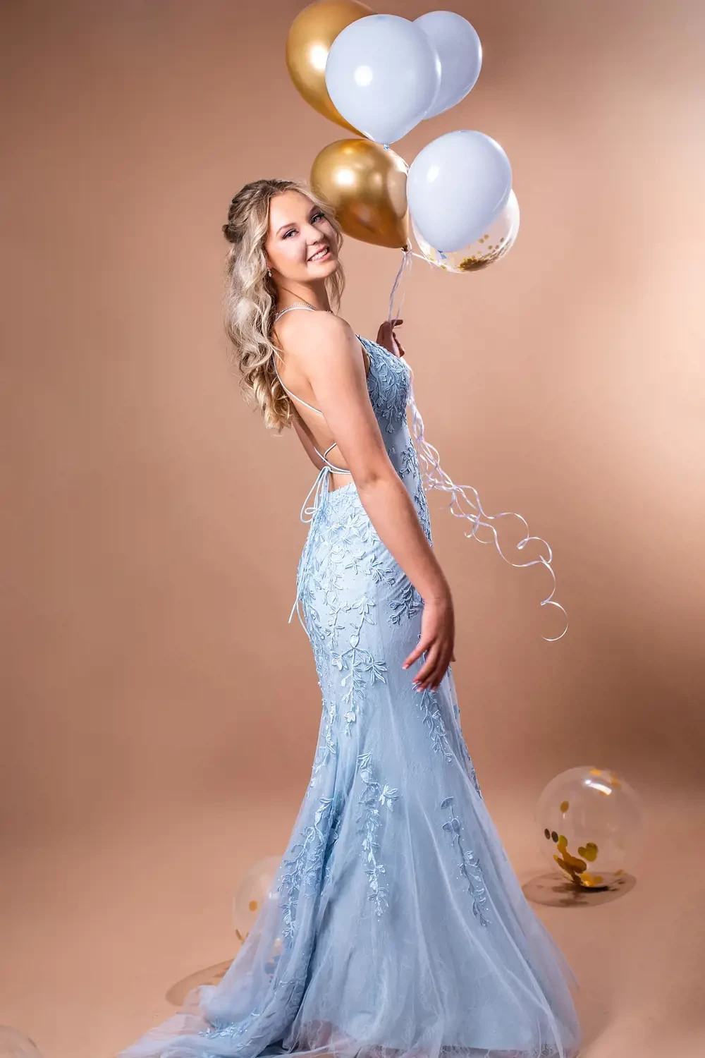 Model wearing a light blue dress