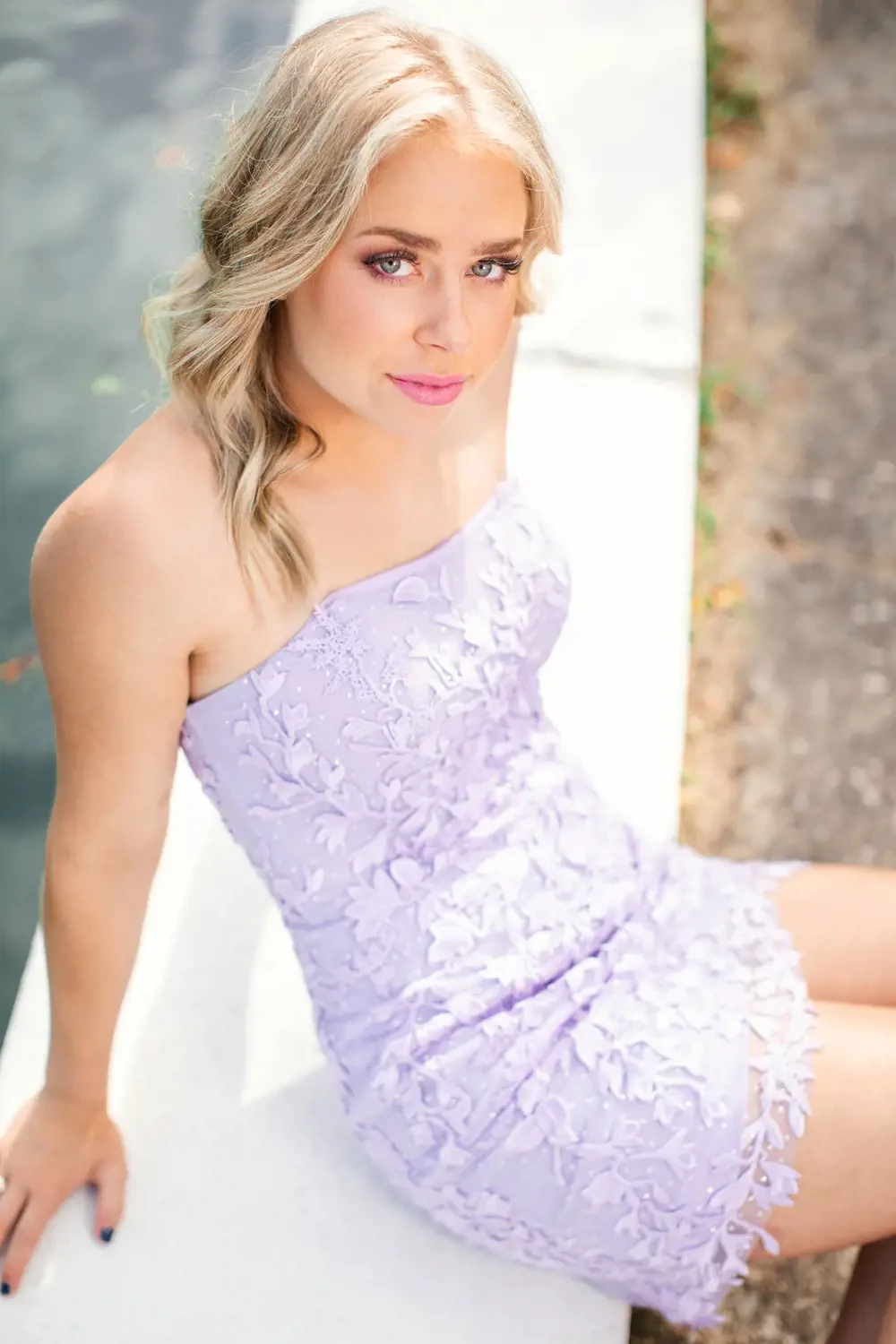 Model wearing a violet gown