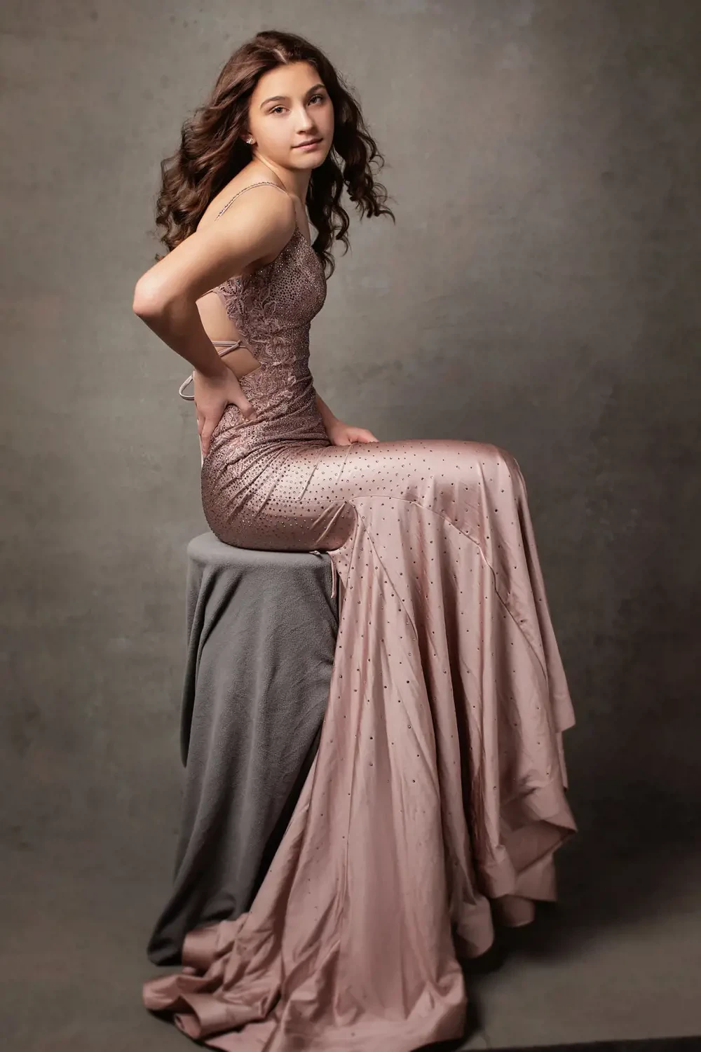 Model wearing a brown dress