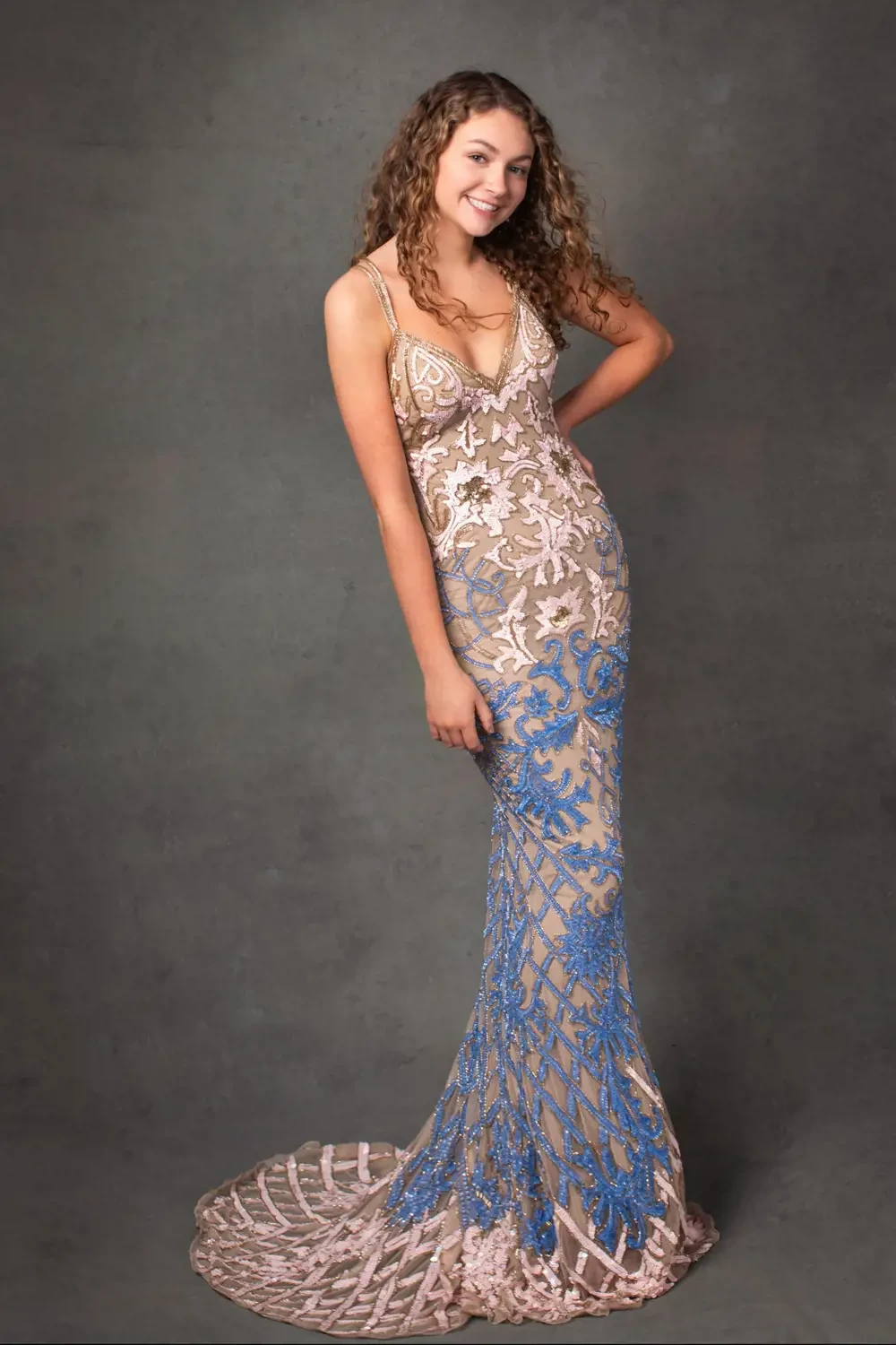 Model wearing a white-blue dress